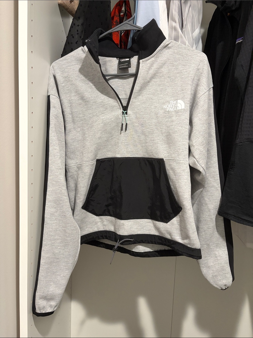 The North Face Light Grey Half-Zip Pullover with Black Pocket Trim